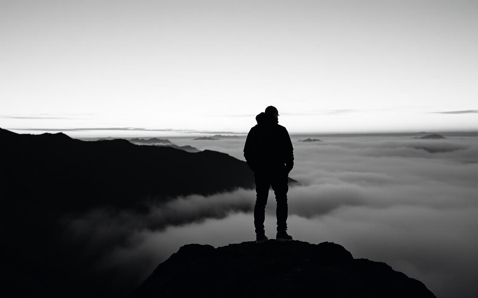 A solitary hiker on a ridge
